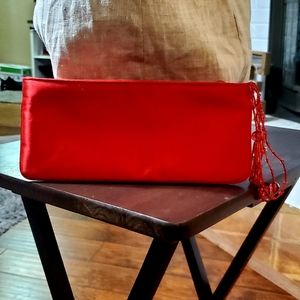 La Regale Red satin purse.
